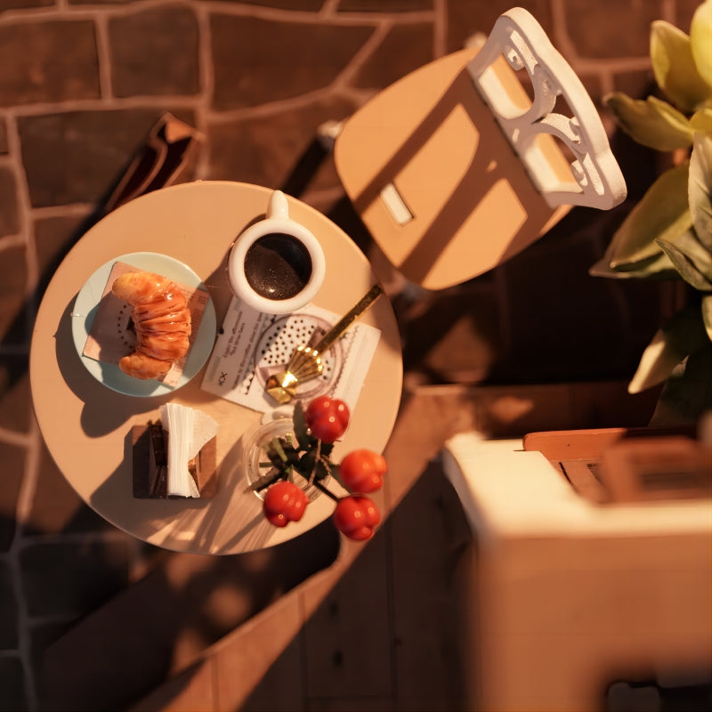 Miniature café decor with vintage chairs, mugs, coffee tools, and wood accents.