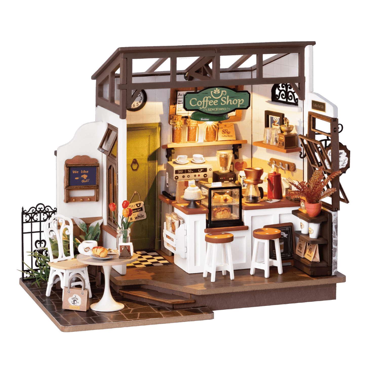 Miniature café interior with vintage chairs, coffee tools, and wood decor.